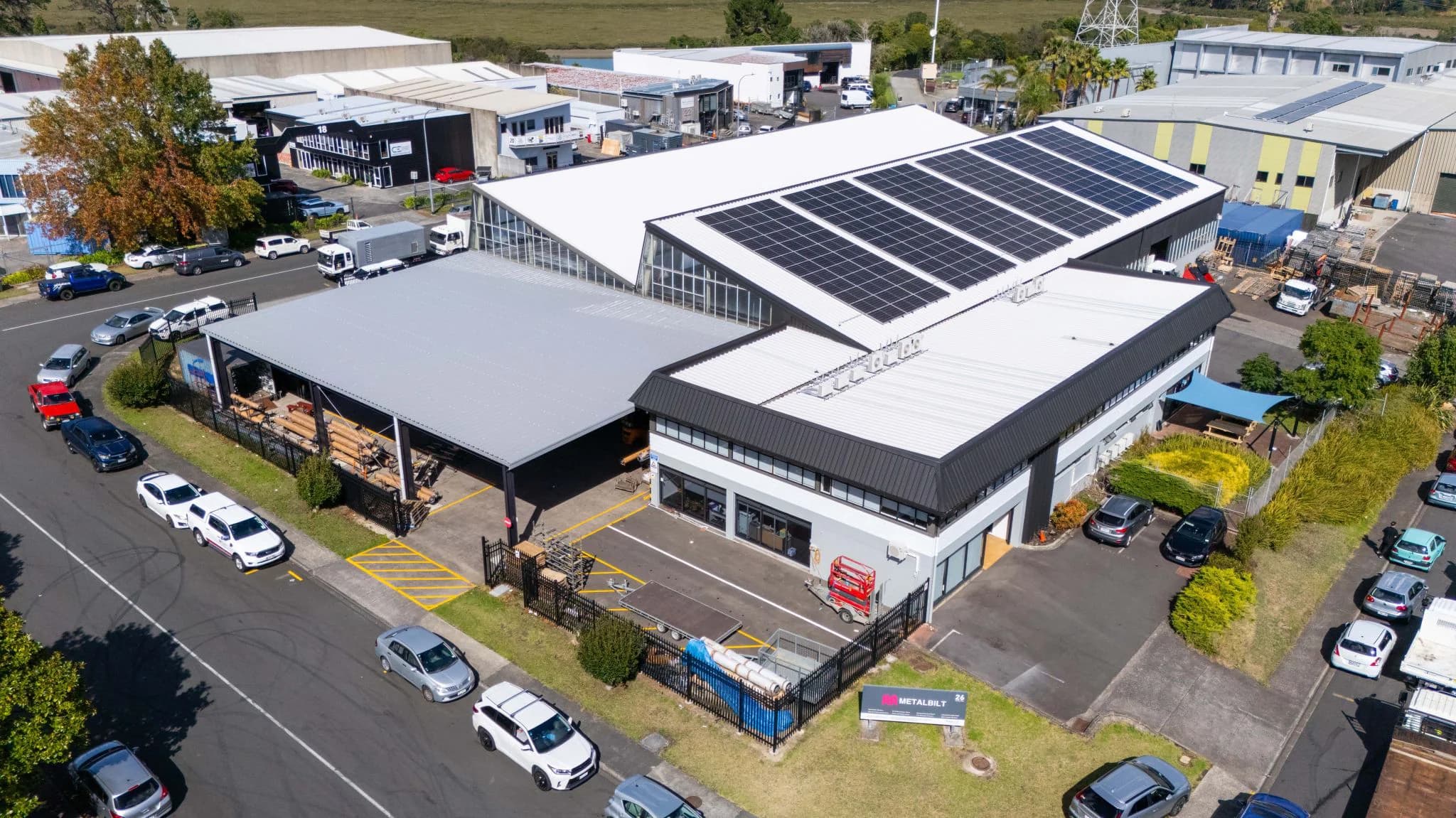 Oblique aerial view of solar panels on the ARA Metalbilt industrial roof